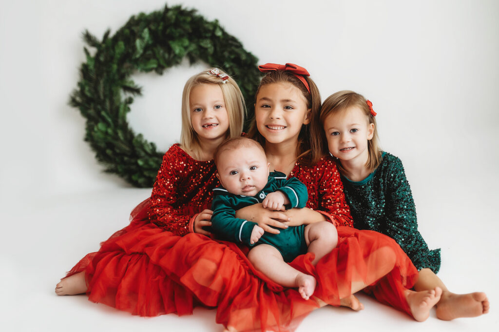 Children pose for Holiday Portraits at Asheville, NC Photo Studio.