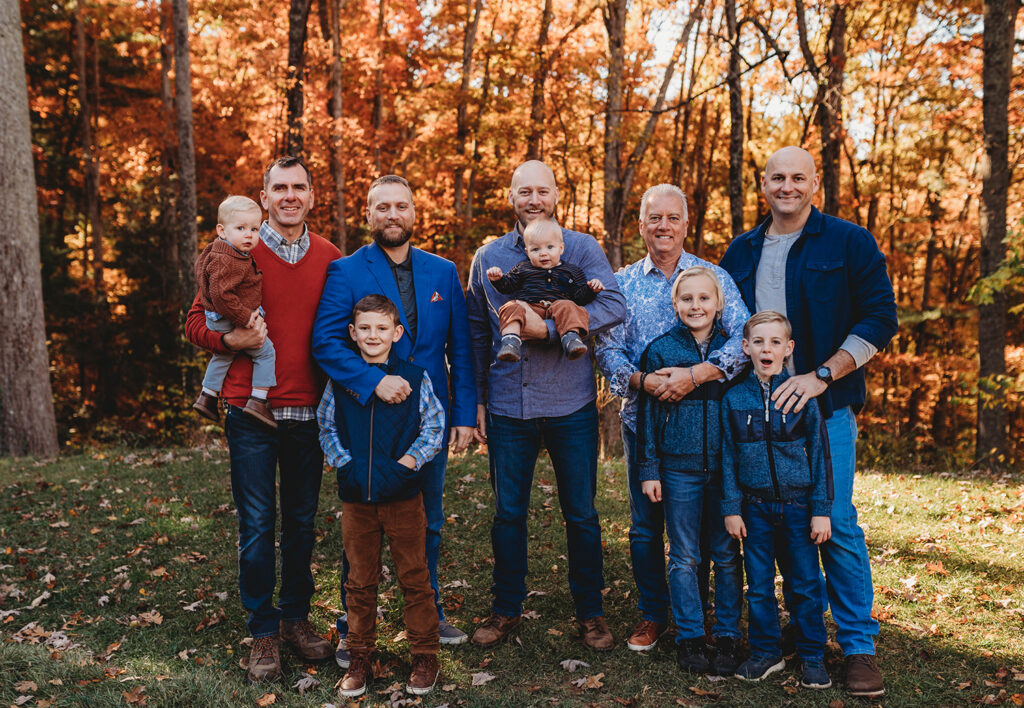 Family poses for Fall Family Portraits in Asheville, NC after learning about the Best Places to See Fall Color in Asheville..