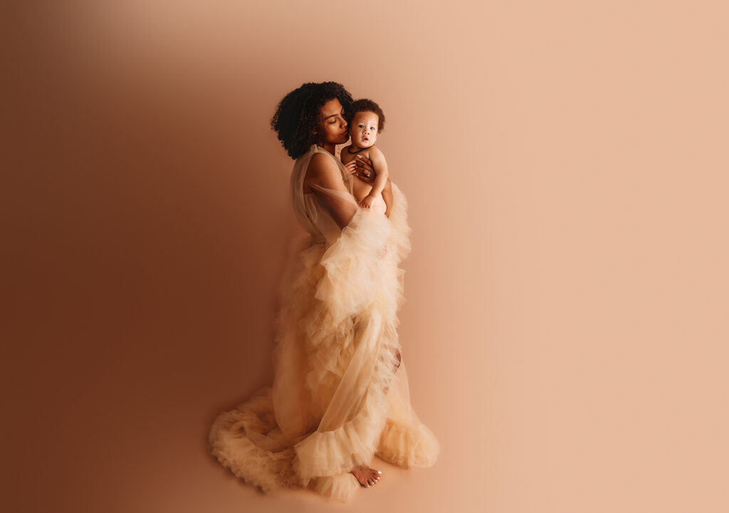 Mother poses with baby for Fine Art Portraits at Asheville NC Photography Studio.