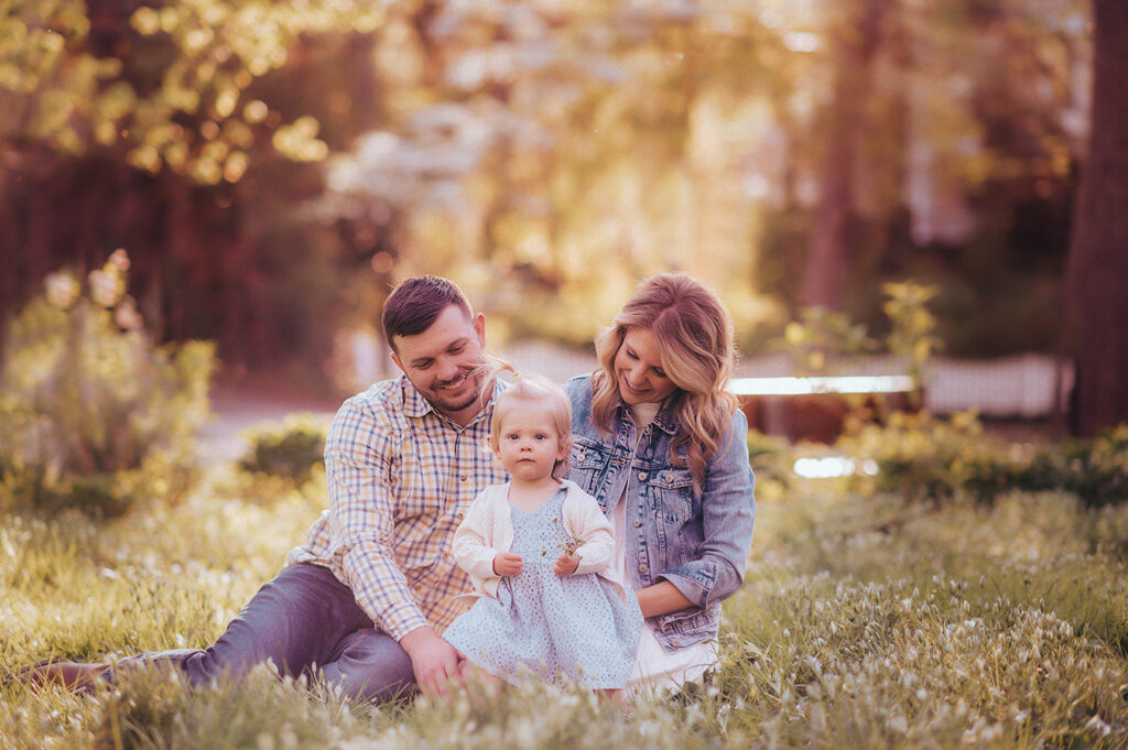 Parents embrace their baby during a Spring Photoshoot in Ashville, NC.