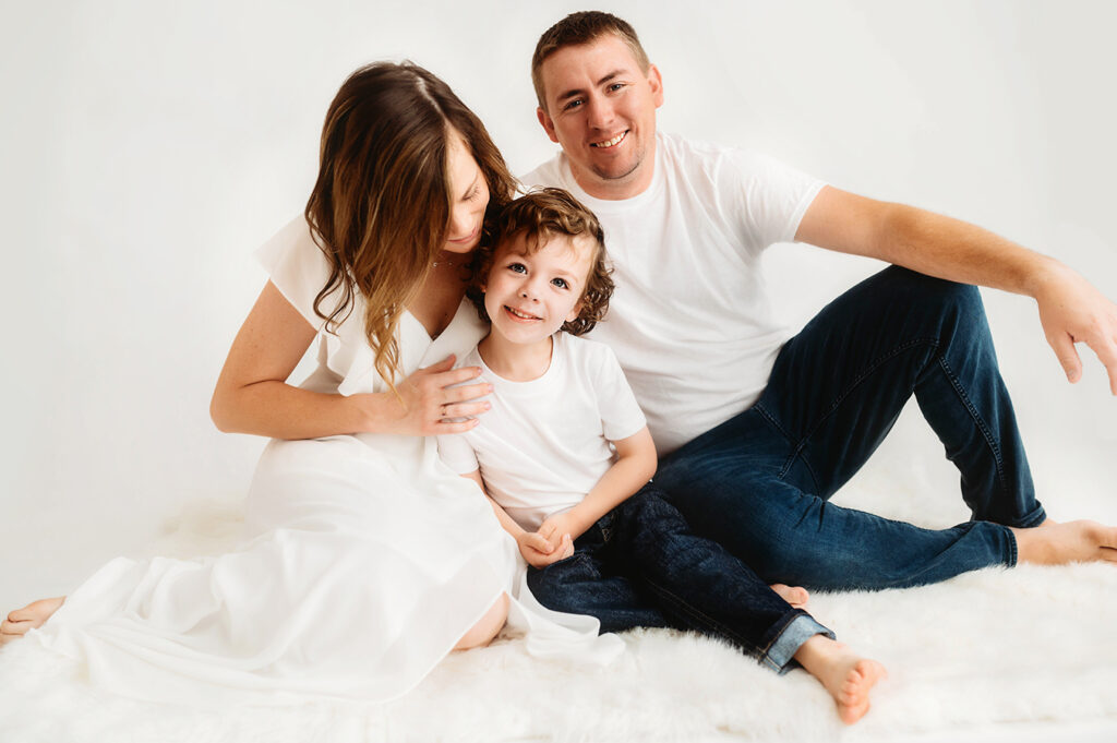 Family poses for All White Portrait Session at Asheville, NC Family Photography Studio.