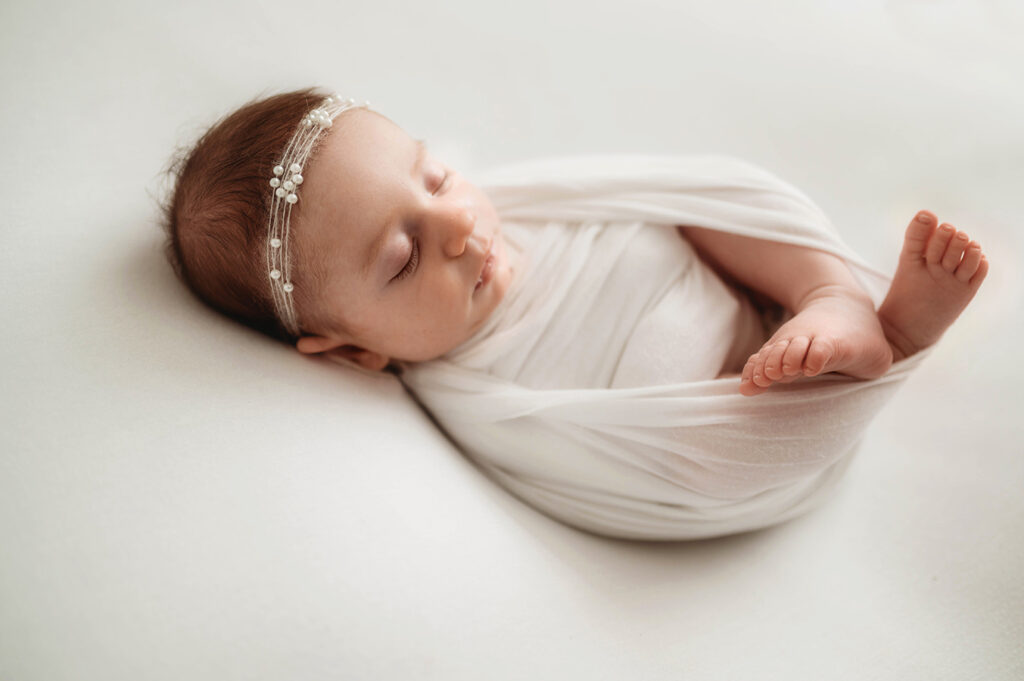 Newborn baby posed for Newborn Photos as Asheville, NC Newborn Photography Studio.