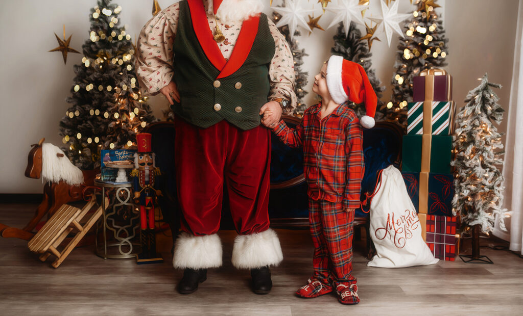 Children interact with Santa during a Santa Mini Session at Asheville, NC Portrait Studio.