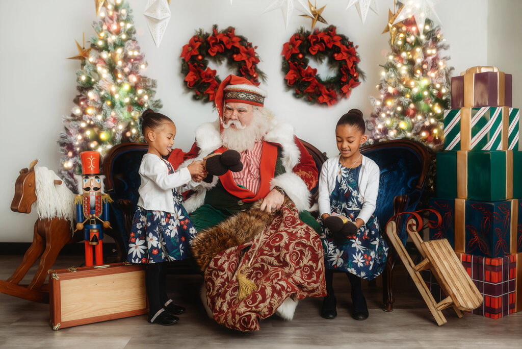 Children interact with Santa during a Santa Mini Session at Asheville, NC Portrait Studio.