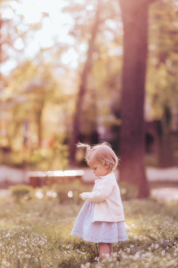 Baby plays in a field of flowers during a Spring Photoshoot in Asheville, NC.