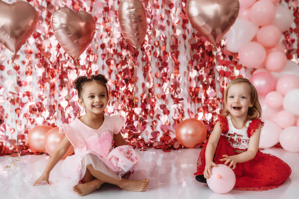 Little girls pose for Valentine's Mini Session at Asheville NC Photography Studio.