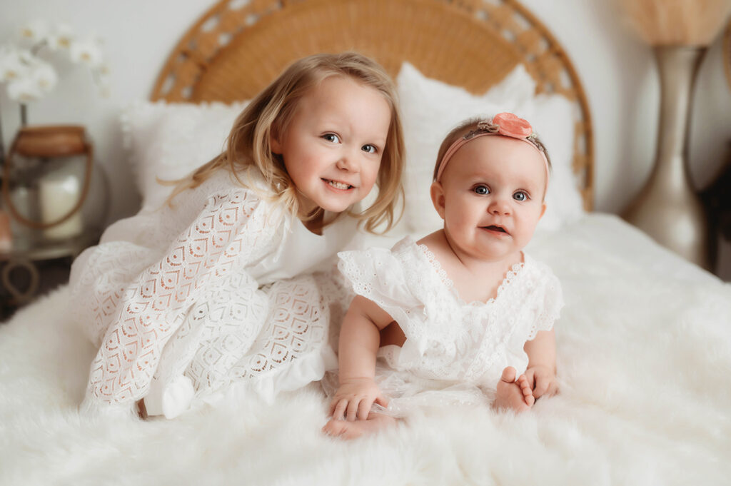 Sisters pose for lifestyle portrait session at Asheville, NC photography studio.