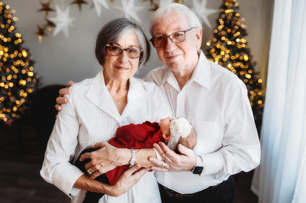 Grandparents posed with Newborn for Newborn Portrait Session at Asheville, NC Newborn Photography Studio.