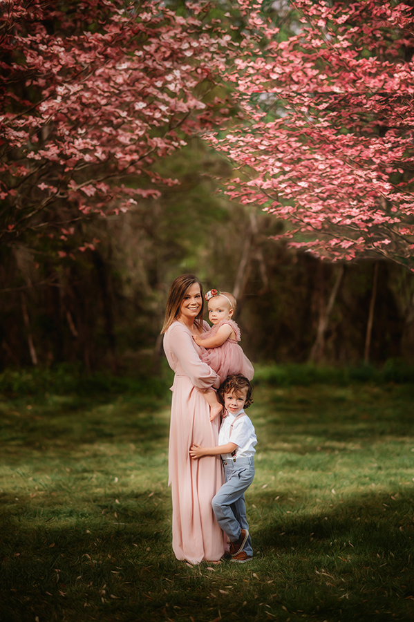Mother poses with her children for Photos during a Family Photoshoot in Asheville, NC.