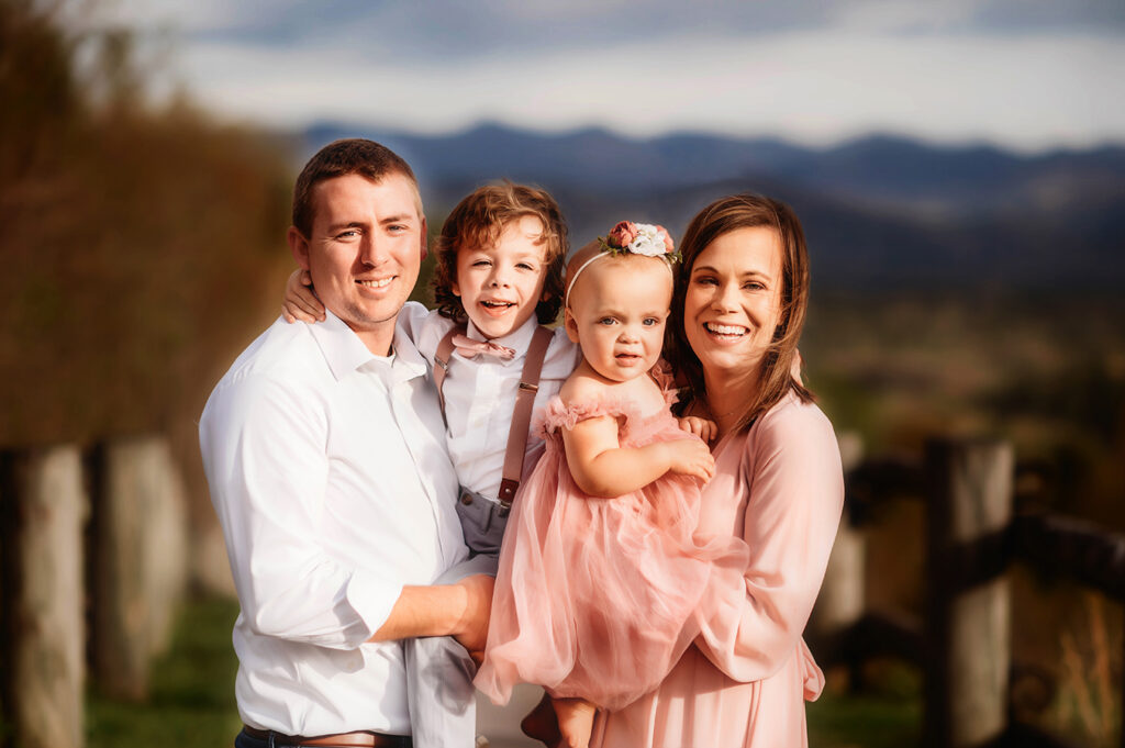 Family poses for Photos during a Family Photoshoot in Asheville, NC.