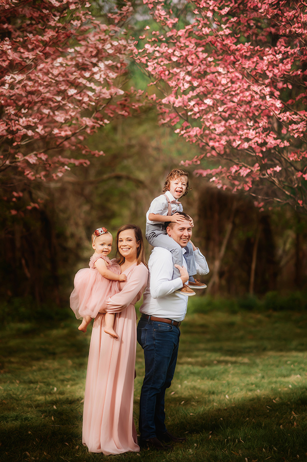 Family poses for Photos during a Family Photoshoot in Asheville, NC.