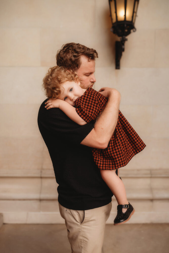 Father hugs his daughter during Family Photoshoot at Biltmore Estate in Asheville, NC.