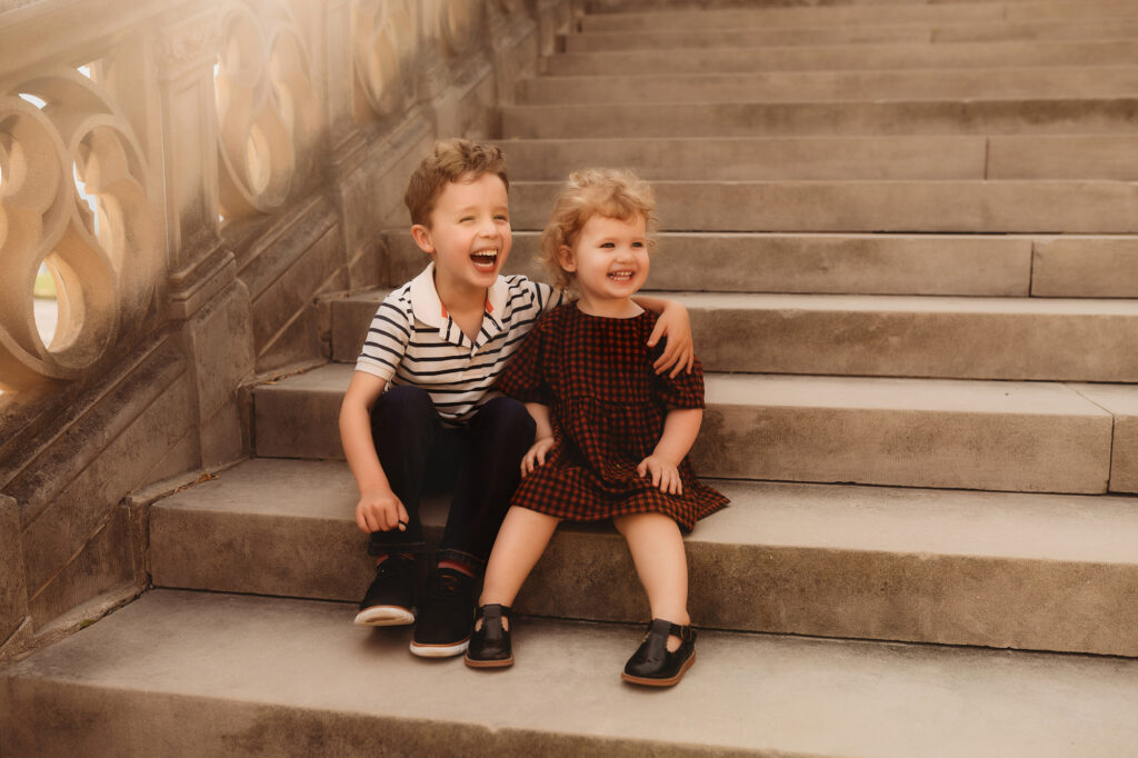 Siblings embrace during Family Photoshoot at Biltmore Estate in Asheville, NC.