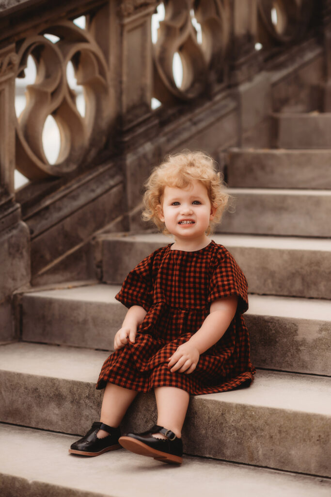 Little girl poses during Family Pictures at Biltmore Estate in Asheville, NC.