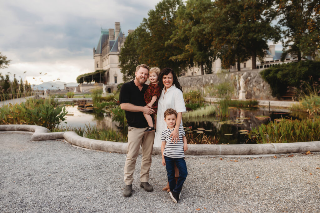 Family poses for Family Portraits at Biltmore Estate in Asheville, NC.
