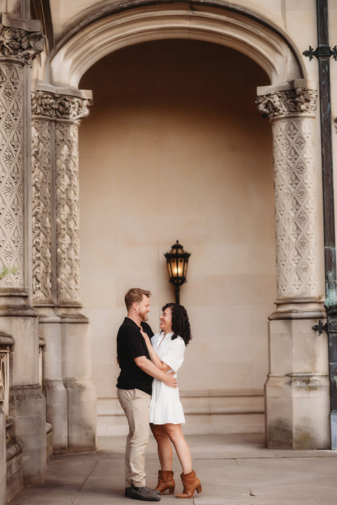 Couple embraces during Fall Family Pictures at Biltmore Estate in Asheville, NC.