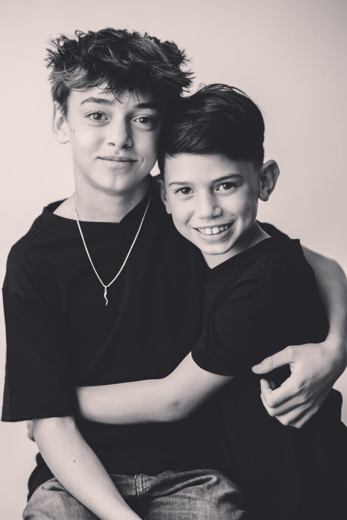 Young boy makes silly faces at the camera during Asheville Personality Portrait Pop-Up.