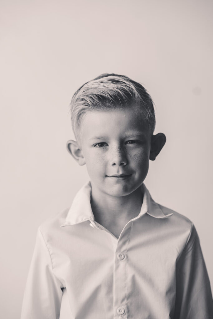 Little boy glares at the camera during the Asheville Personality Portrait Pop Up