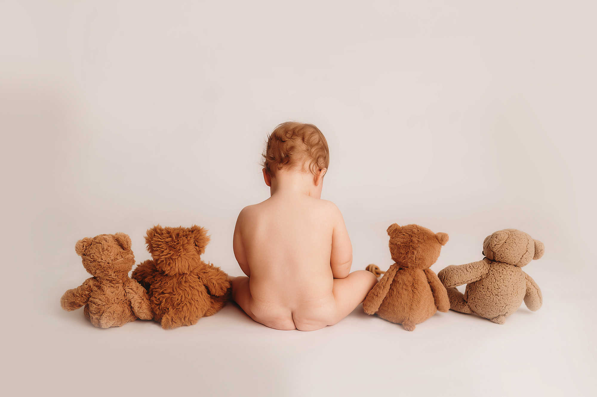 Baby celebrates his first birthday with a Birthday Cake Smash Photoshoot in Asheville, NC after his mother learns about the Best Cloth Diapering Services in Asheville.