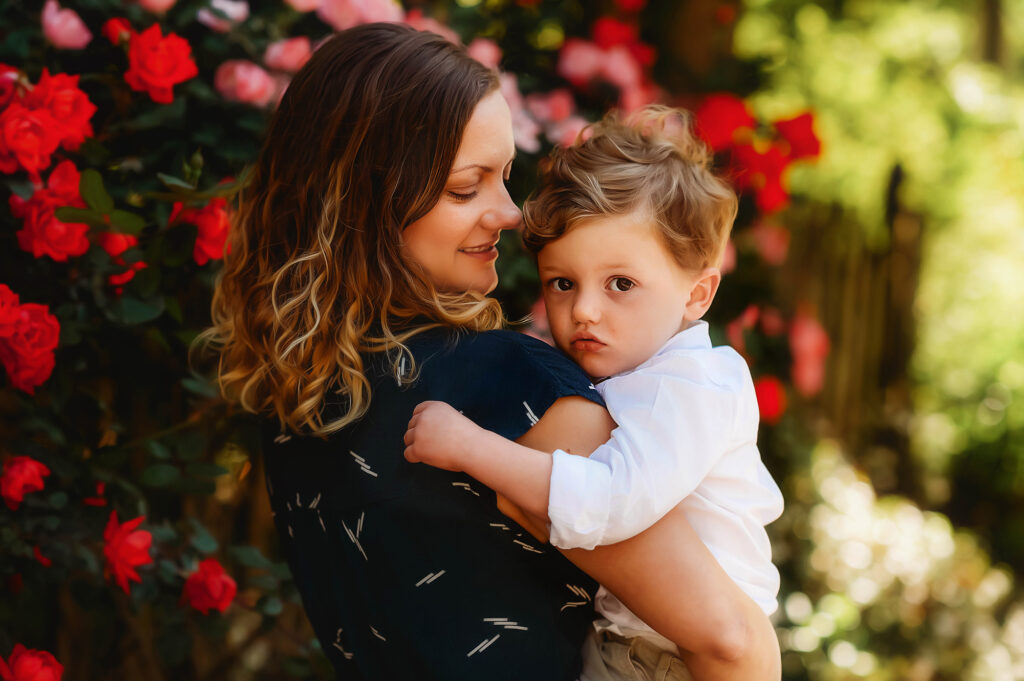 Mother embraces her son during her Mother's Day Mini Session in Asheville. 