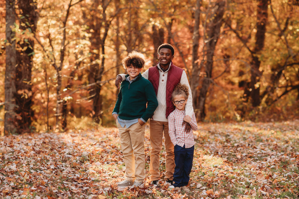 Siblings pose for Family Pictures during Fall Family Portraits on the Blue Ridge Parkway in Asheville, NC.