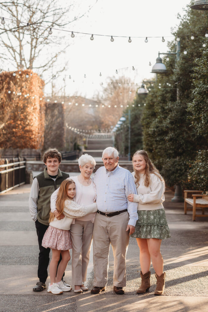 Grandparents pose with their grandchildren during Extended Family Photoshoot at the NC Arboretum in Asheville, NC. 