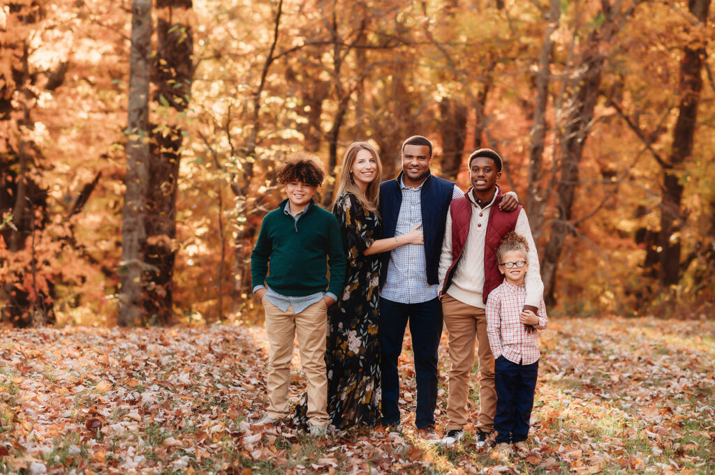 Family poses for Fall Family Photos in Asheville, NC.