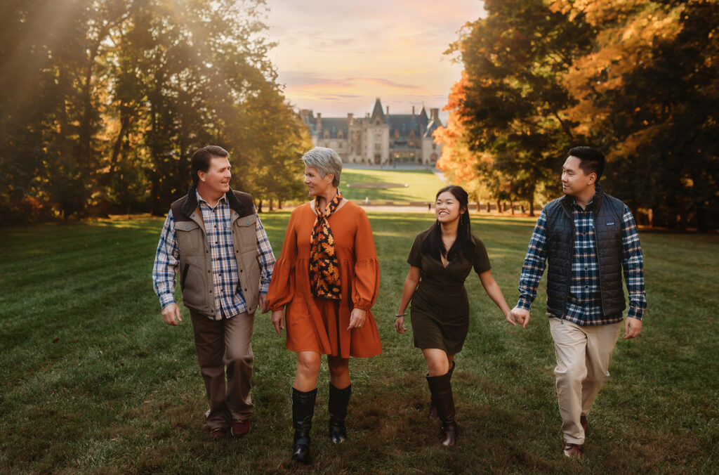 Family walks together on a hillside during their Biltmore Estate Family Photos.