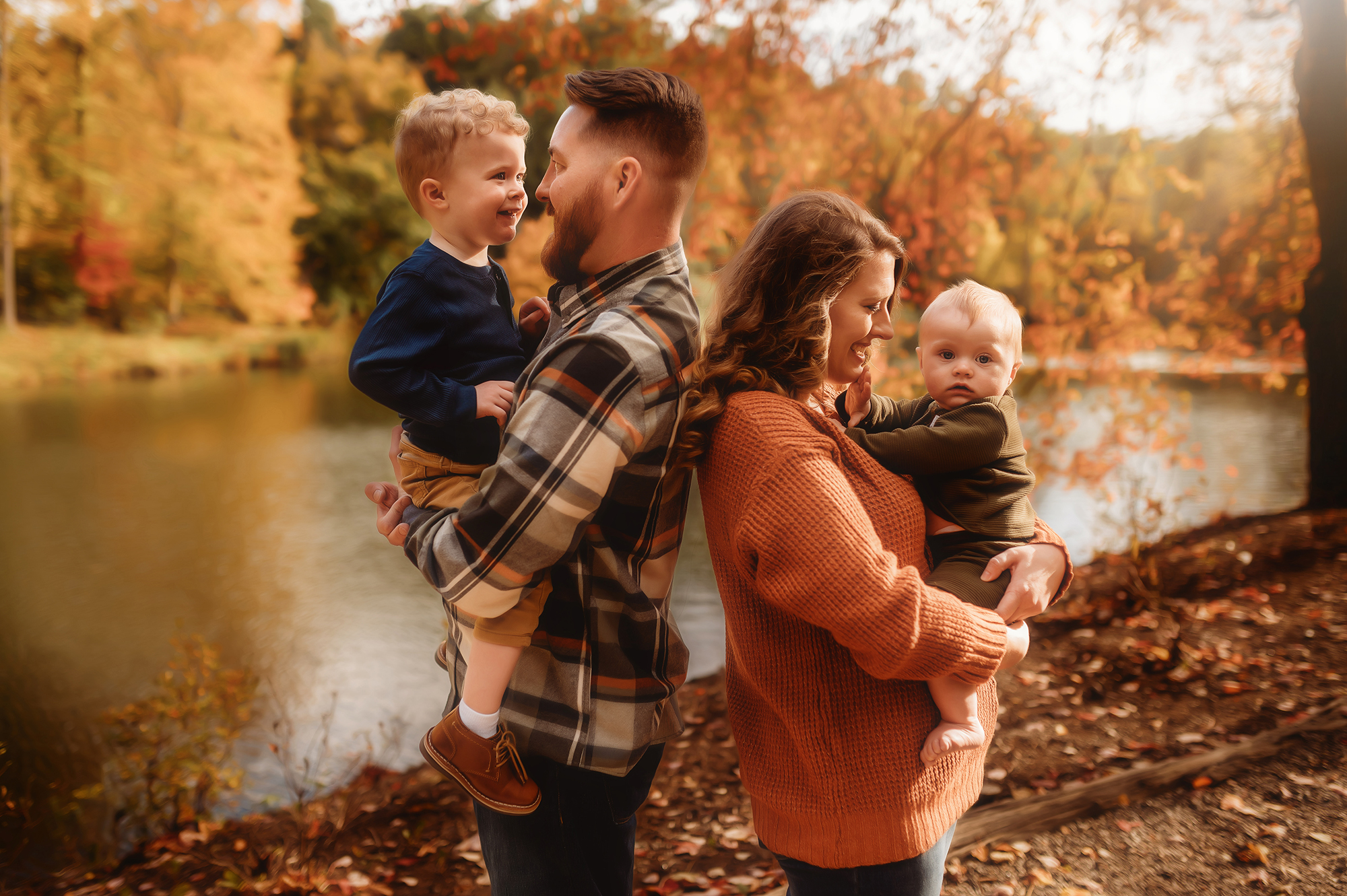 Parents embrace their children during Family Photoshoot at Biltmore Estate in Asheville, NC.