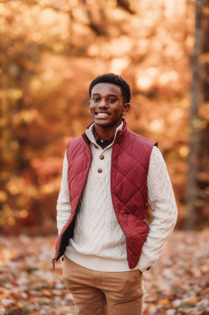 Young men smile at the camera during Fall Family Portraits on the Blue Ridge Parkway in Asheville, NC.