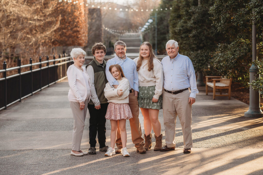 Family poses together during Extended Family Portraits at the North Carolina Arboretum in Asheville
