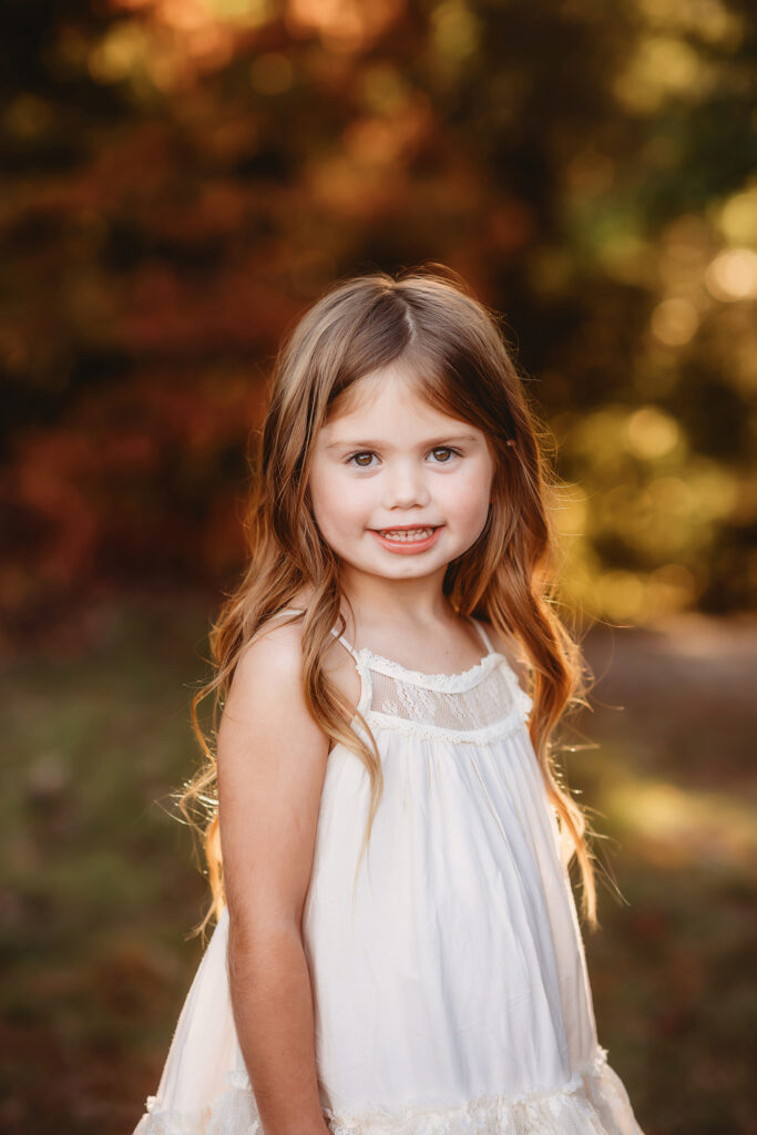 Little girls poses for Family Photos in Asheville.