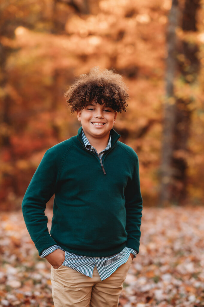 Young men smile at the camera during Fall Family Portraits on the Blue Ridge Parkway in Asheville, NC.