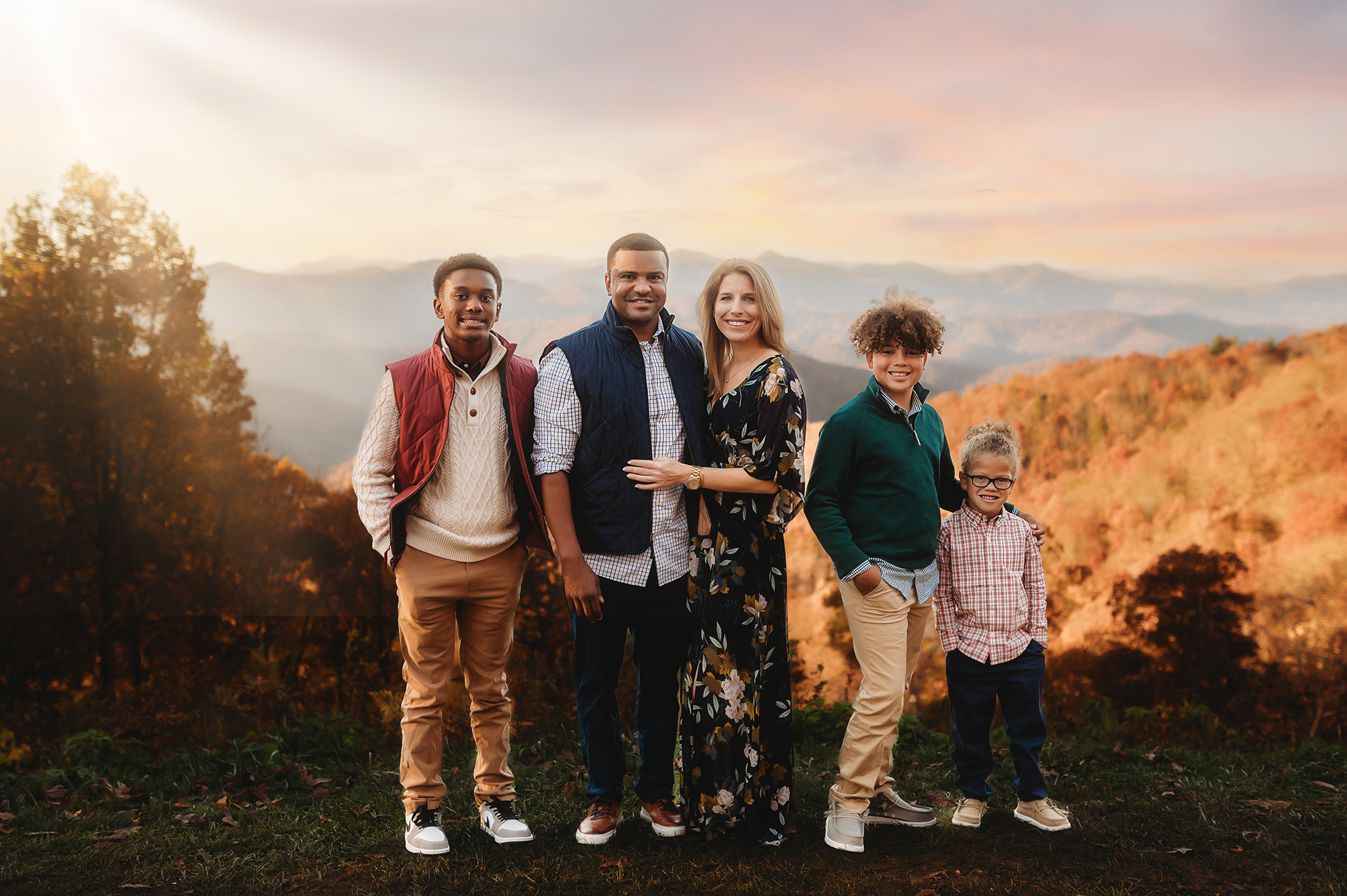 Family poses for Family Portraits on the Blue Ridge Parkway in Asheville, NC.