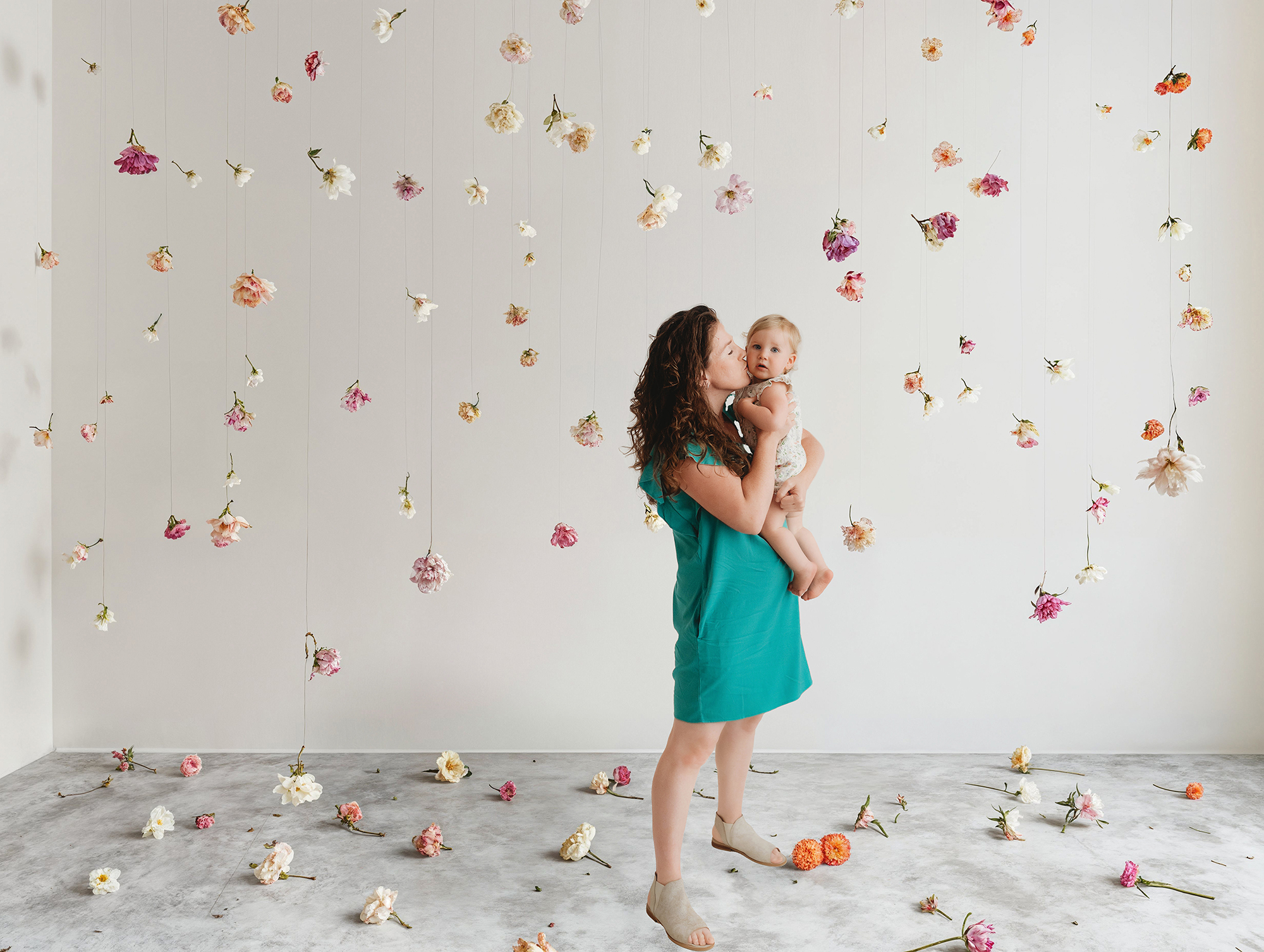 Mother embraces her daughter during Mommy & Me Mini Sessions in Asheville, NC.