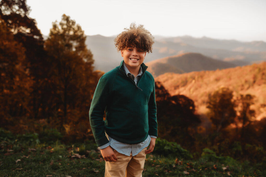 Child poses for portraits during their Family Photoshoot in Asheville. 