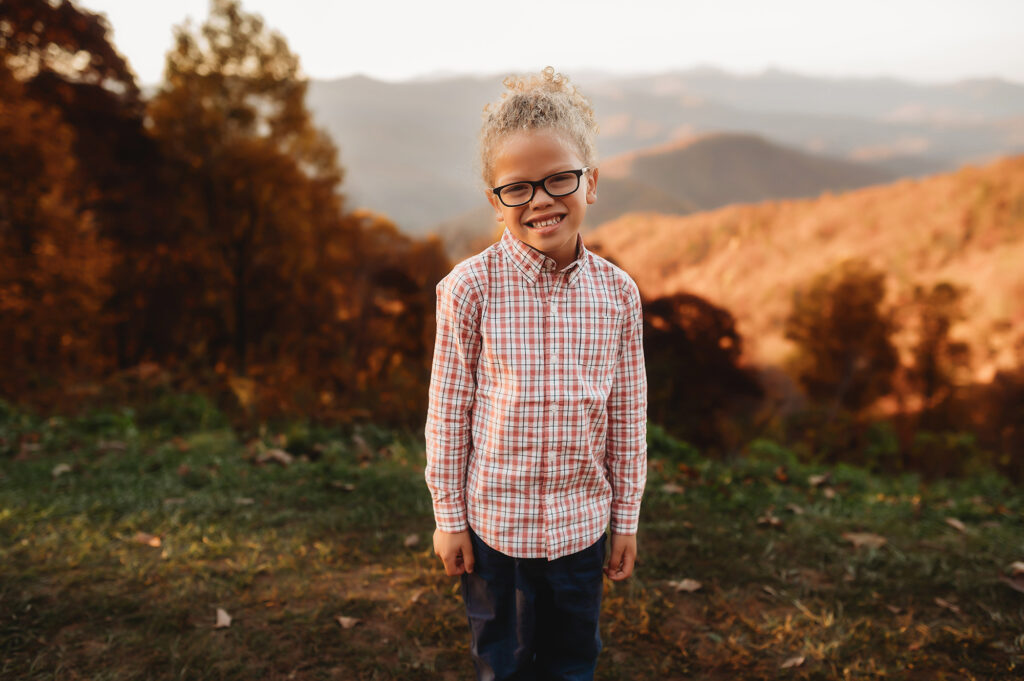 Child poses for portraits during their Family Photoshoot in Asheville. 