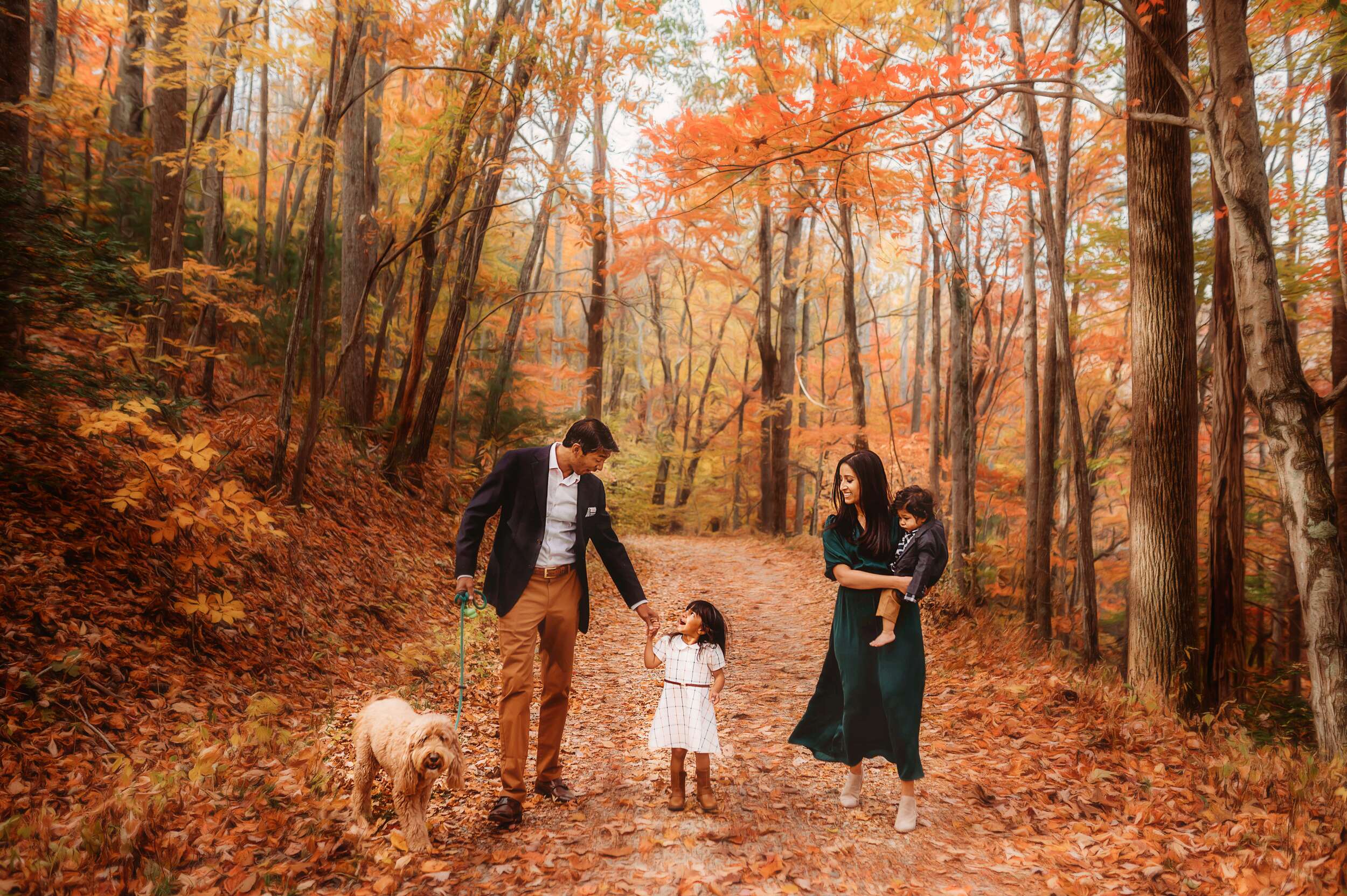 Family Poses for Fall Family Photos on the Blue Ridge Parkway in Asheville, NC.
