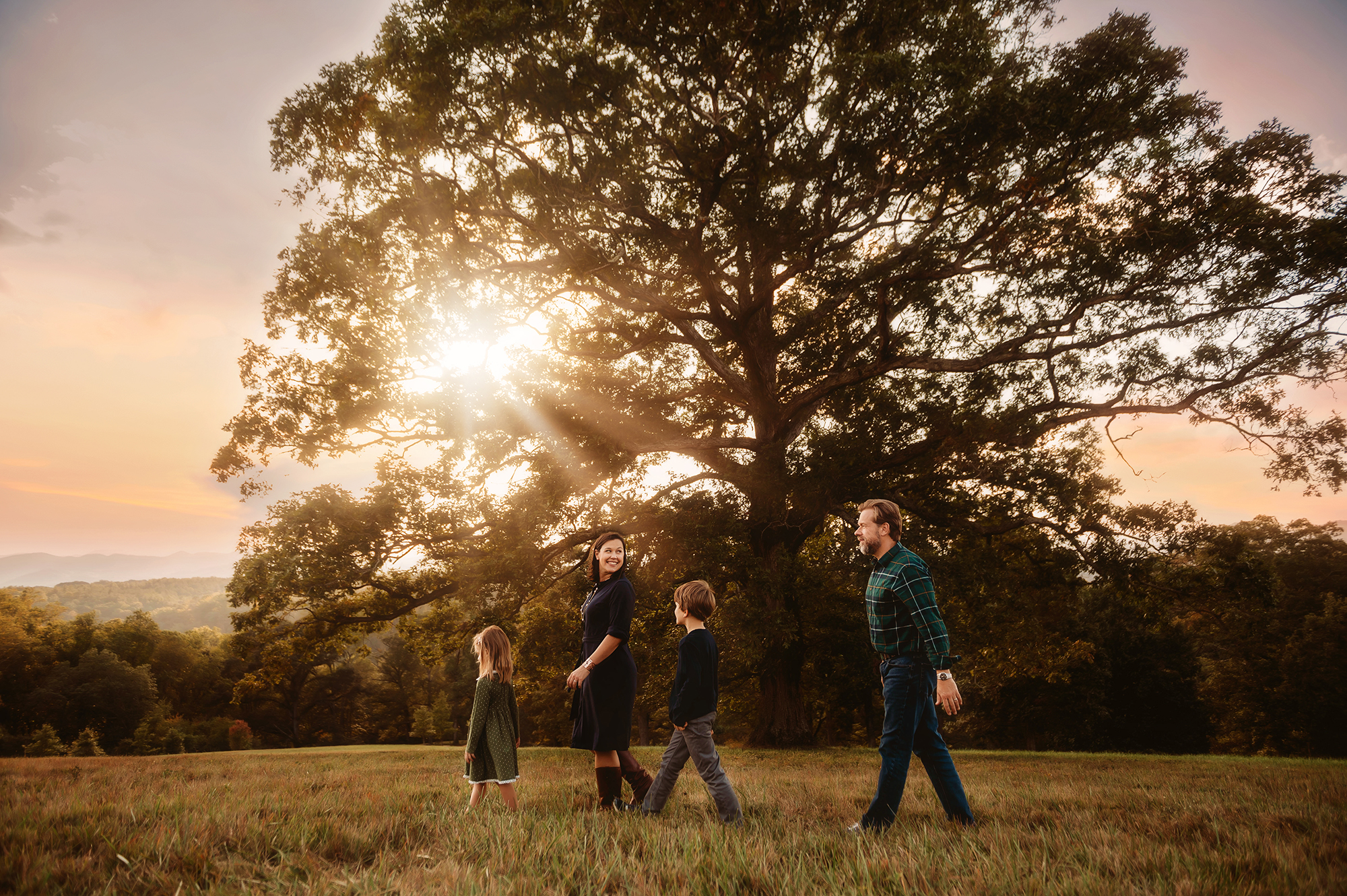 Family walks along together during Family Photos in Asheville, NC.