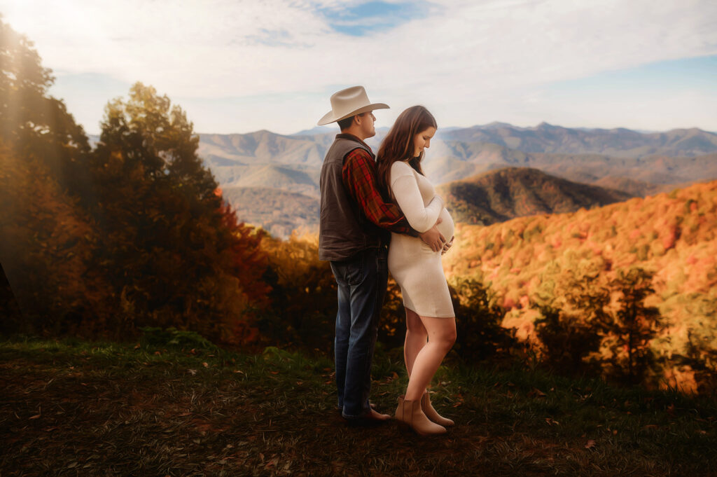 Expectant parents pose for Maternity Portraits on the Blue Ridge Parkway during their Babymoon in Asheville.