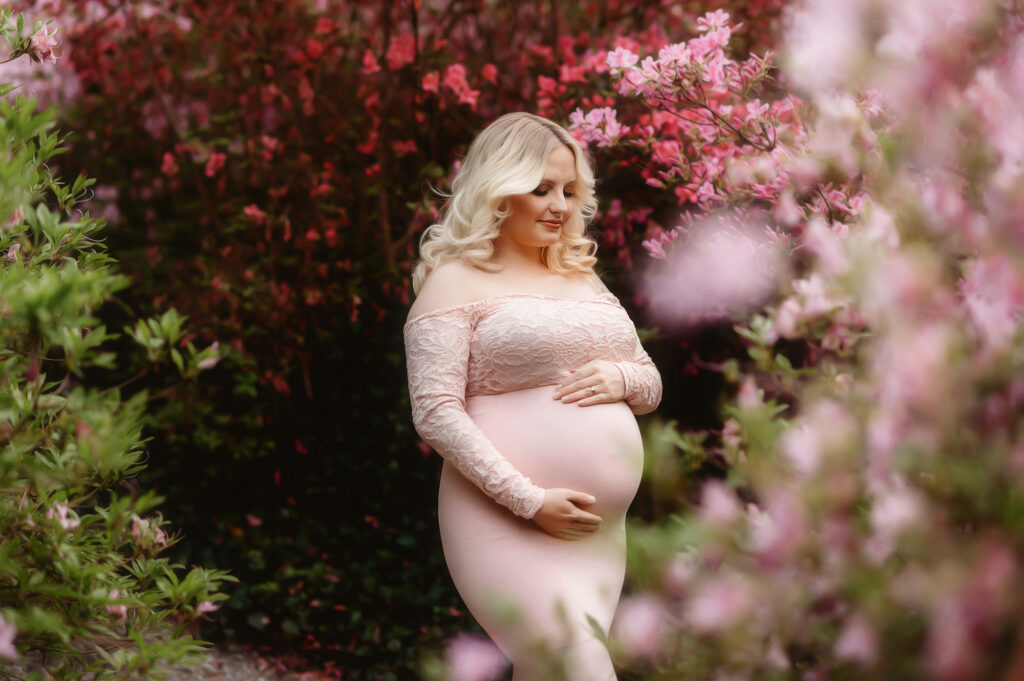 Pregnant woman poses for Maternity Portraits at Biltmore Estate in Asheville, NC.