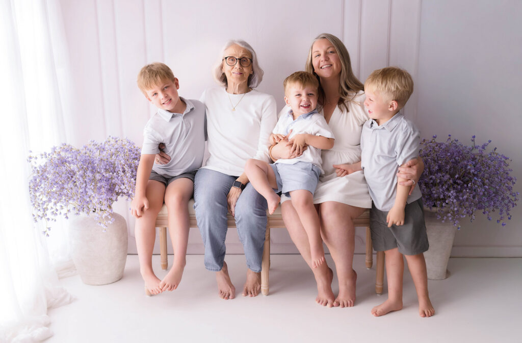 Mother embraces her children during Mother's Day Mini Session in Asheville, NC. 