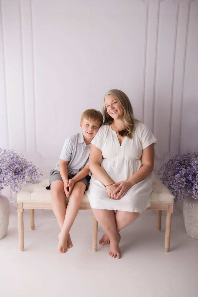Mother sits with her eldest son during Mother's Day Mini Session in Asheville, NC. 