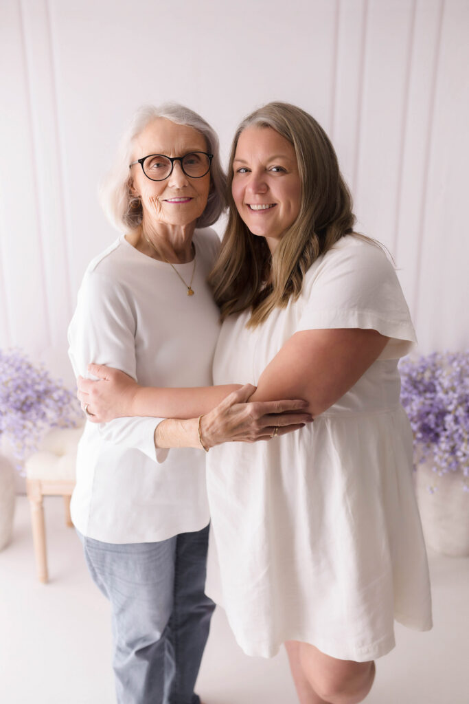 Mother embraces her daughter during Mother's Day Mini Session in Asheville, NC. 