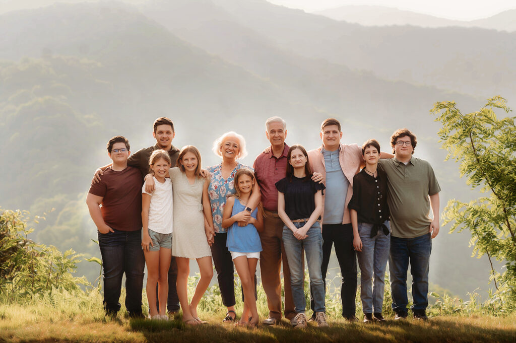 Grandparents pose with their grandchildren for portraits during their Family Reunion Photoshoot in Asheville, NC. 