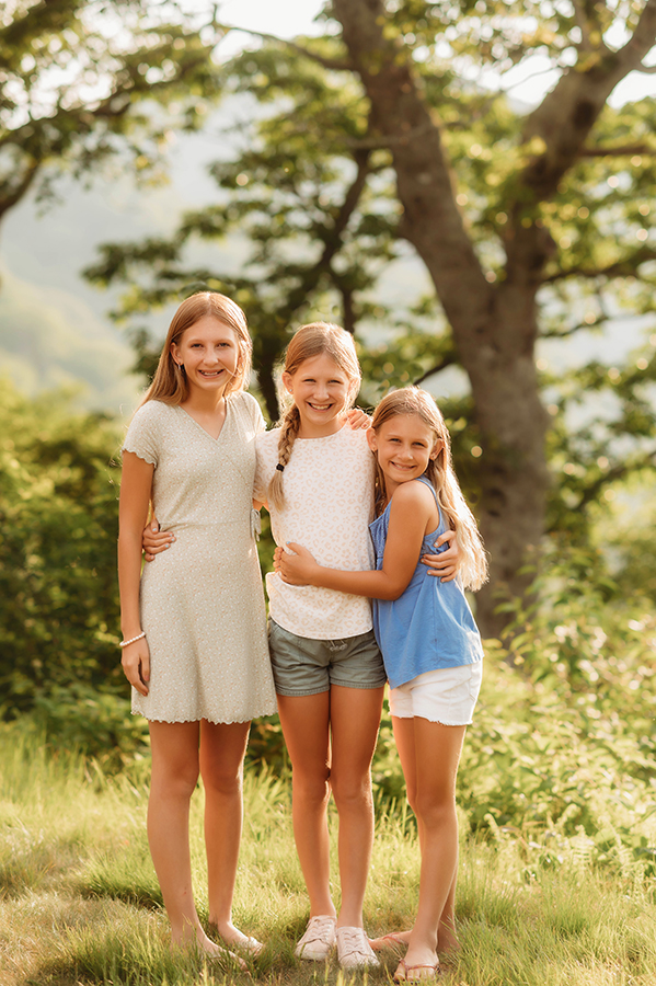 Siblings pose for portraits during their Family Reunion Photoshoot in Asheville, NC.