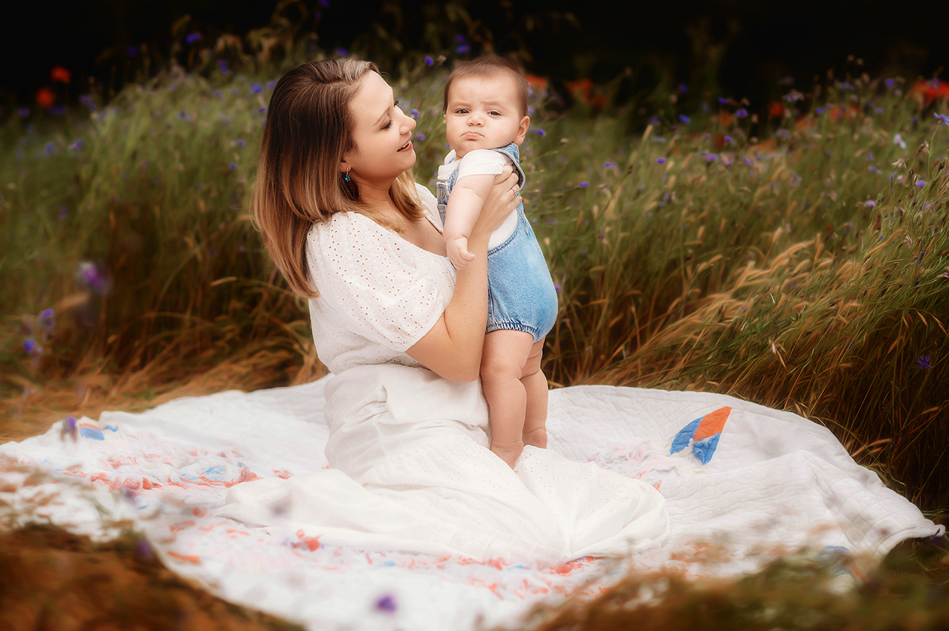 Motherhood Photoshoot shot I a wildflower field in Asheville, NC.