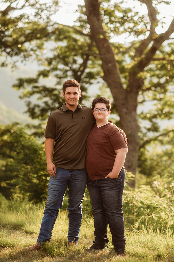 Siblings pose for portraits during their Family Reunion Photoshoot in Asheville, NC. 
