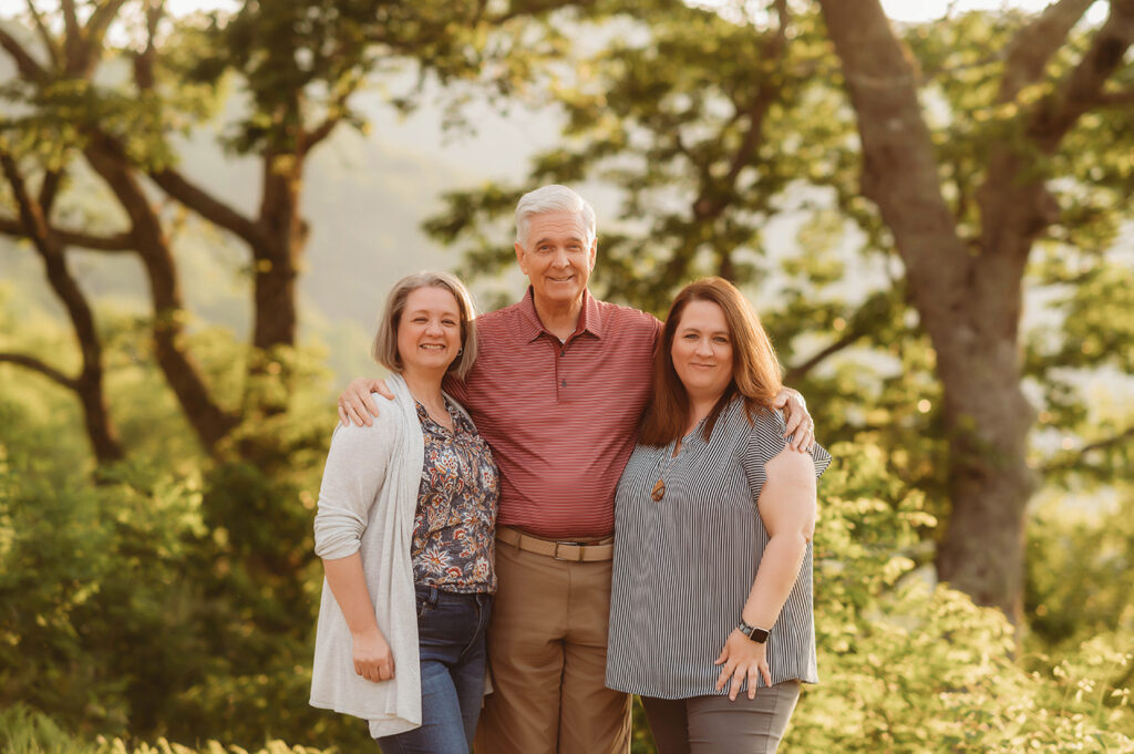 Elderly Parents pose with their original children for portraits during their Family Reunion Photoshoot in Asheville, NC. 