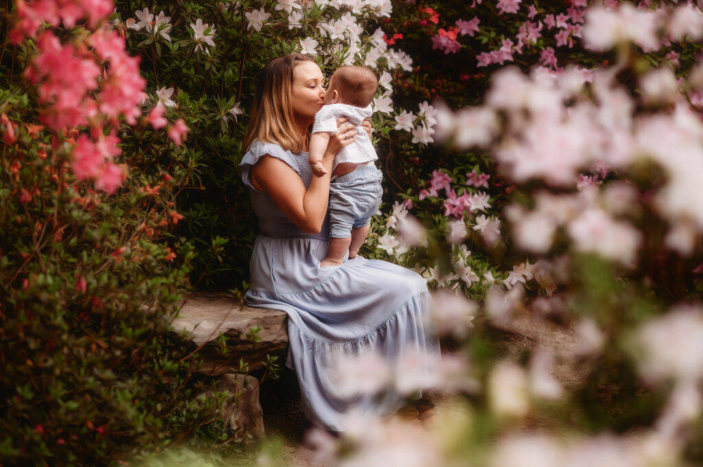 Mother poses with her baby for a Spring Photoshoot at Biltmore Estate in Asheville, NC.